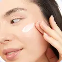 Sense Serenity Cotton Candy Daily Moisturizer the product as a woman smears it on her face